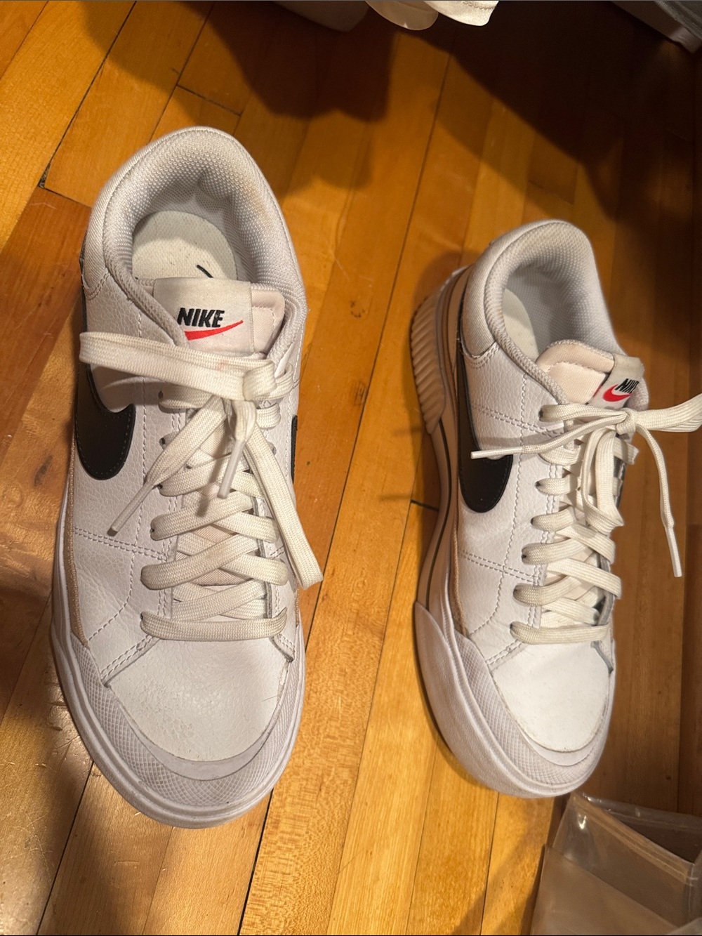 Nike Womens White Sneakers with Black Swoosh and Red Accent